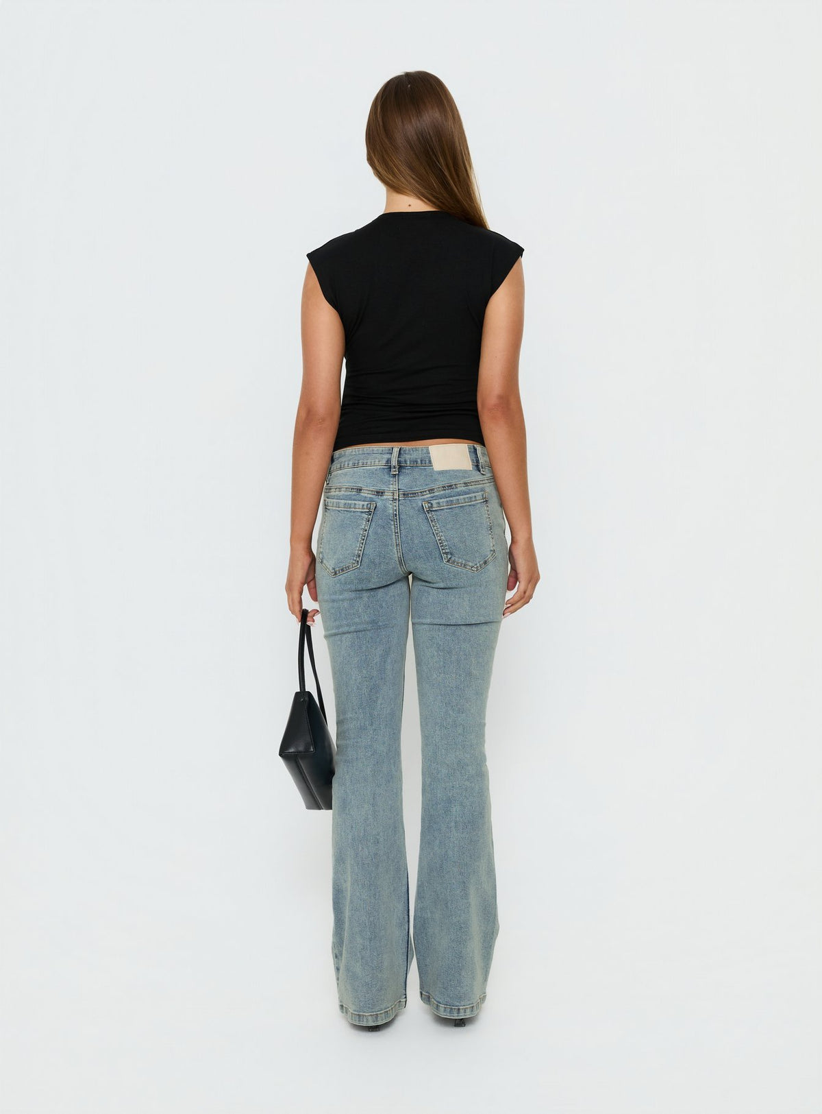 Presenting the Bethany Low Rise Bootleg Jeans Ice Wash womens-jeans with low-rise back view of model wearing