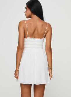 back view of model wearing Princess Polly Patterstone Mini Dress White V-Neck 