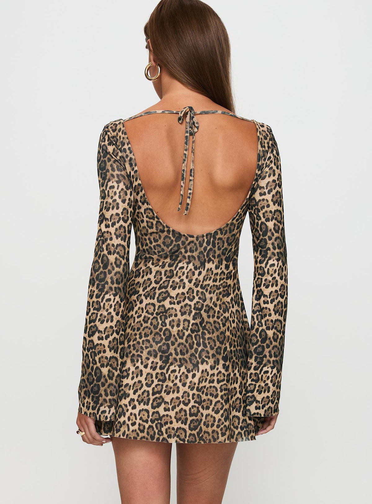 back view of model wearing Princess Polly Lukea Long Sleeve Mini Dress Leopard Boat Neck 