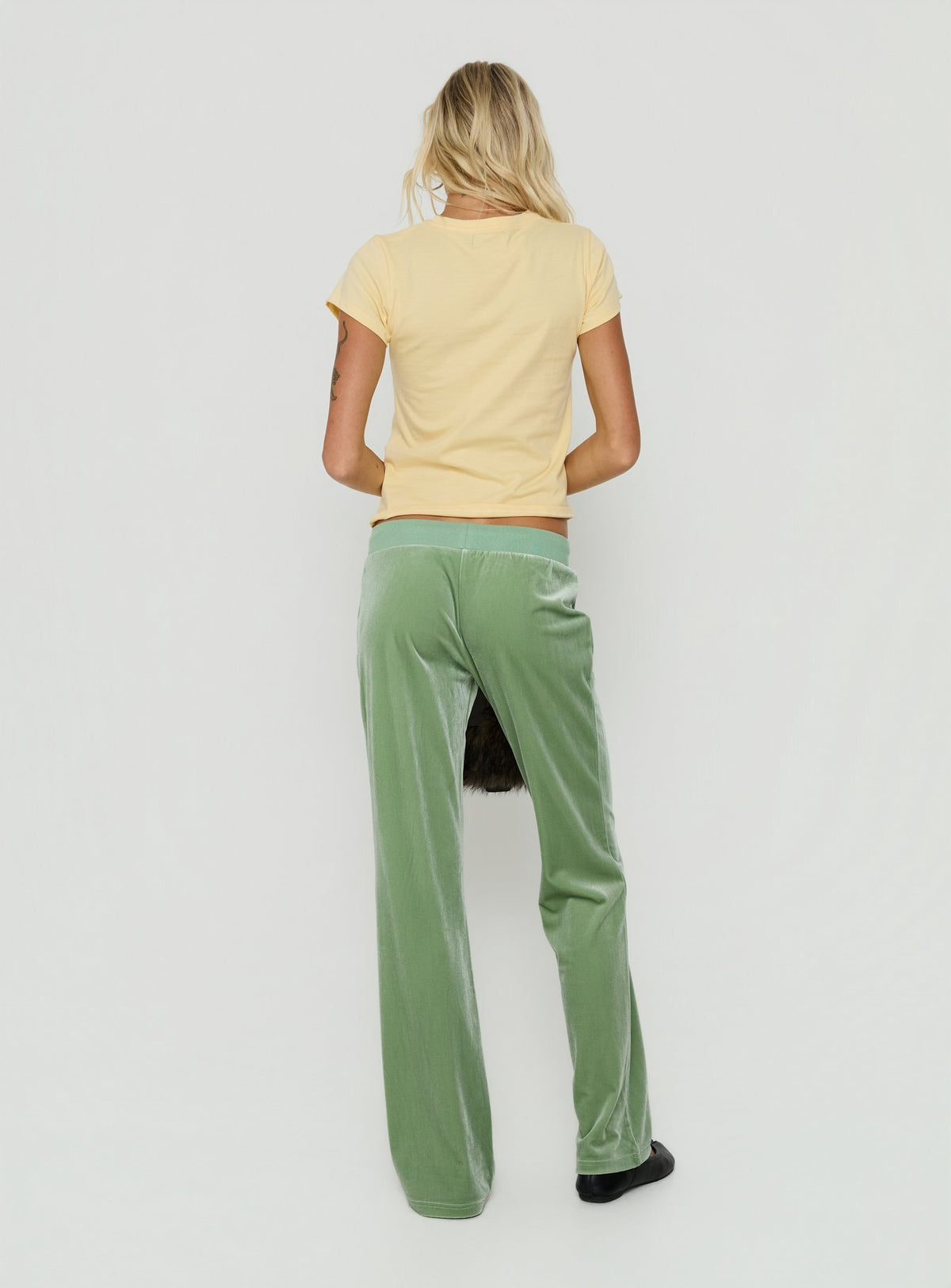Presenting the Alba Track Pant Sage in womens-regular-pants mid-rise back view of model wearing Princess Polly