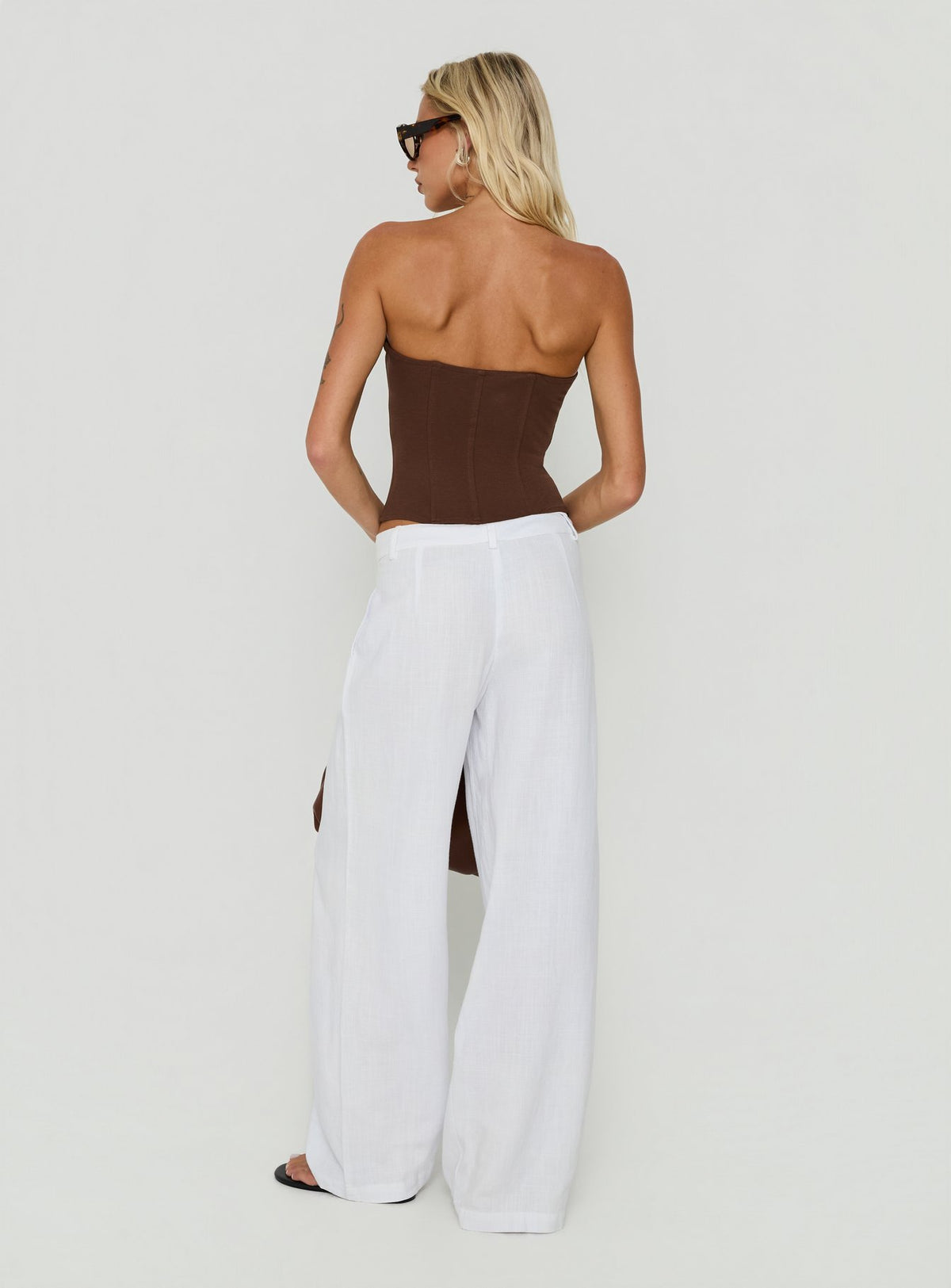 Presenting the Syrena Tailored Wide Leg Pant White in womens regular pants with high-rise back view of model wearing Princess Polly