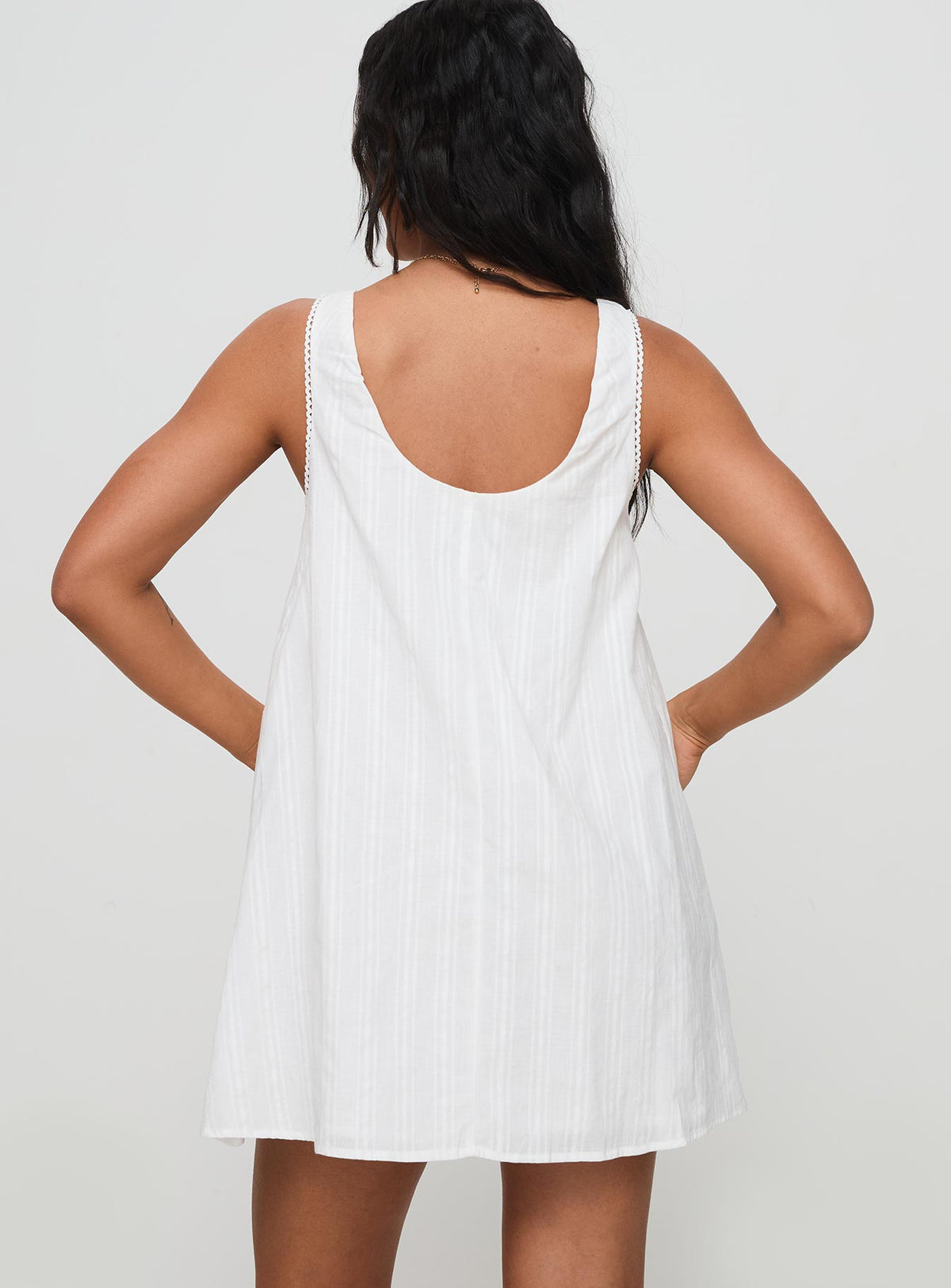 back view of model wearing Princess Polly Antiquity Swing Mini Dress White Petite V-Neck 