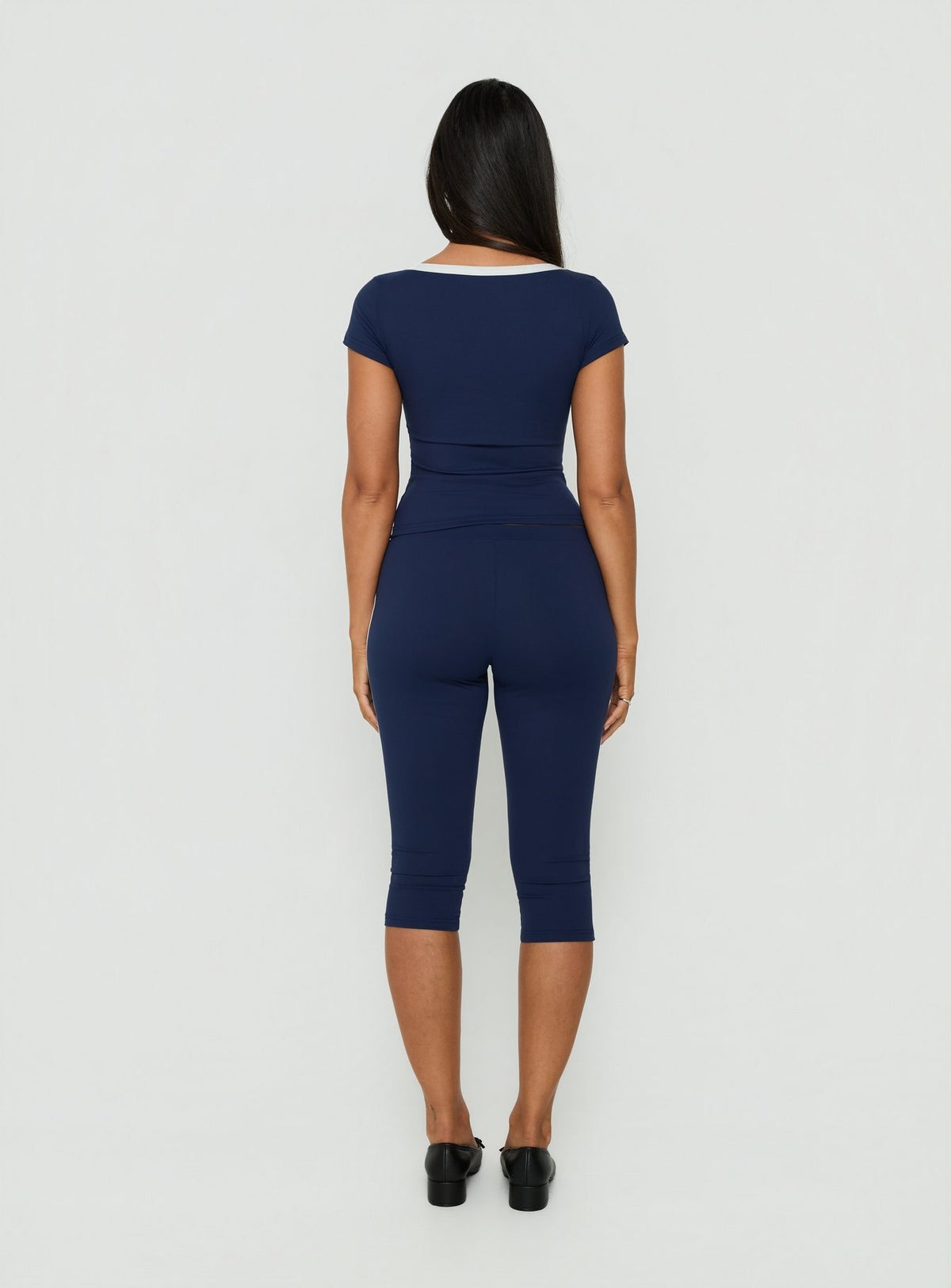 Explore the Rowanna Sporty Capri Pants Navy / Cream womens-regular-pants with high-rise back view of model wearing Princess Polly