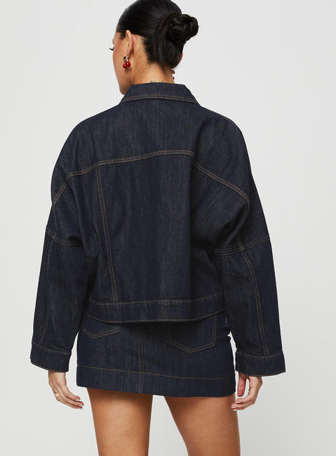 back view of model wearing Princess Polly Hughes Mini Skirt Dark Wash Denim Petite Mini Skirts Skirts 