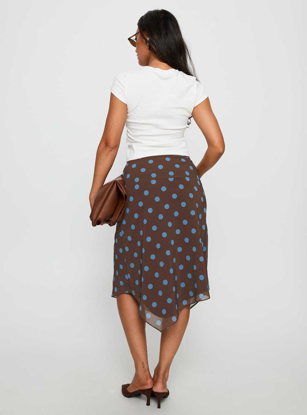 back view of model wearing Princess Polly Daphene Asymmetrical Midi Skirt Brown / Blue Polka Dot Midi Skirts Skirts 