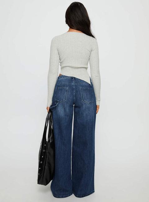 back view of model wearing Princess Polly Downtowner Low Rise Cargo Jeans Mid Blue Wash Low Rise Jeans Jeans 