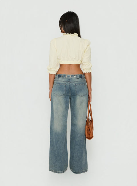 Crafted with the Karlos Low Rise Cinched Baggy Jeans Vintage Mid Blue Wash in womens-jeans featuring abstract print and belt back view of model wearing Princess Polly