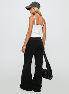 back view of model wearing Princess Polly Summits Flared Track Pants Washed Black High Rise Pants Pants 