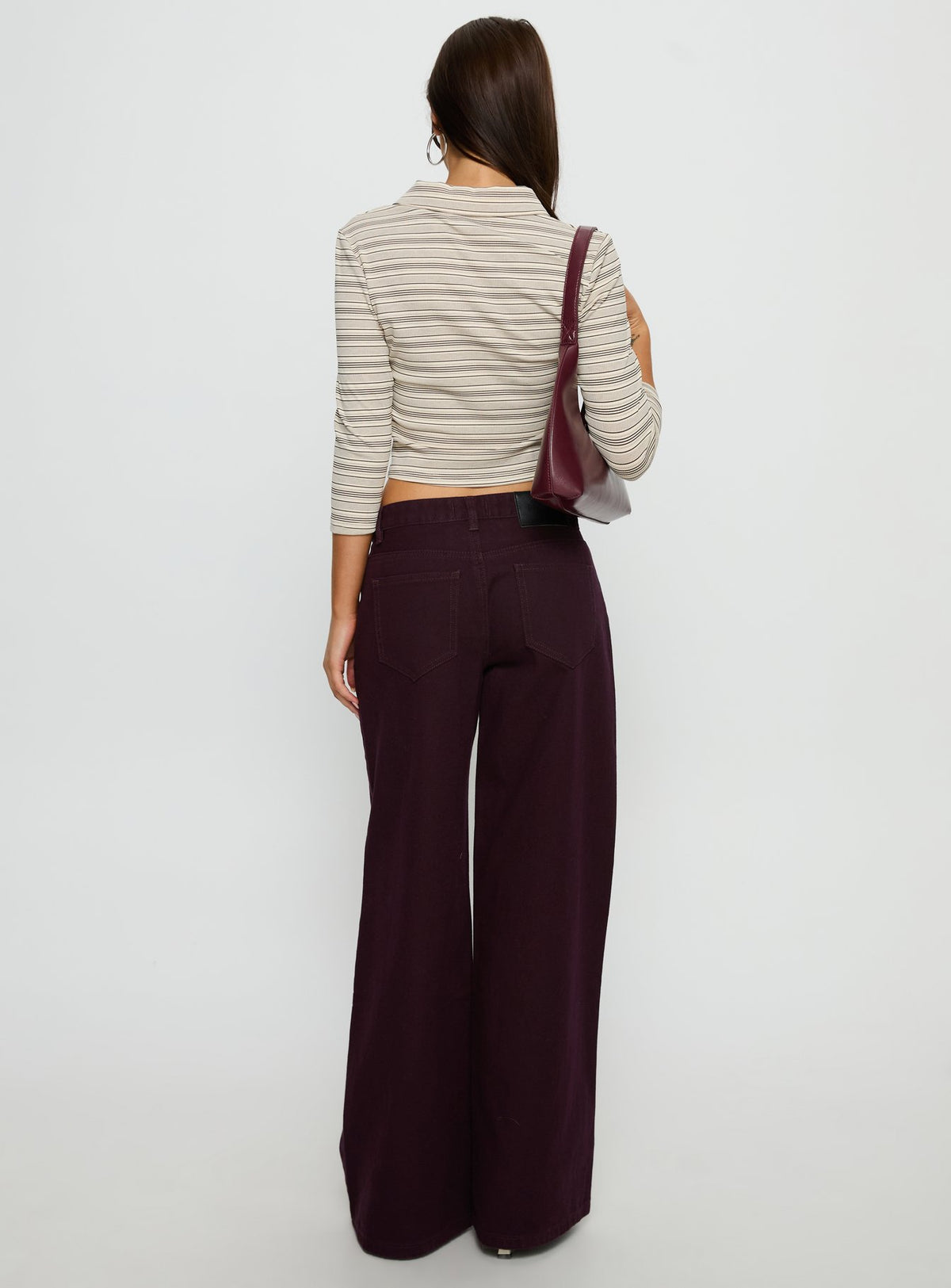 back view of model wearing Princess Polly Supercut Low Rise Baggy Pleat Jeans Currant Mid Rise Jeans Jeans 