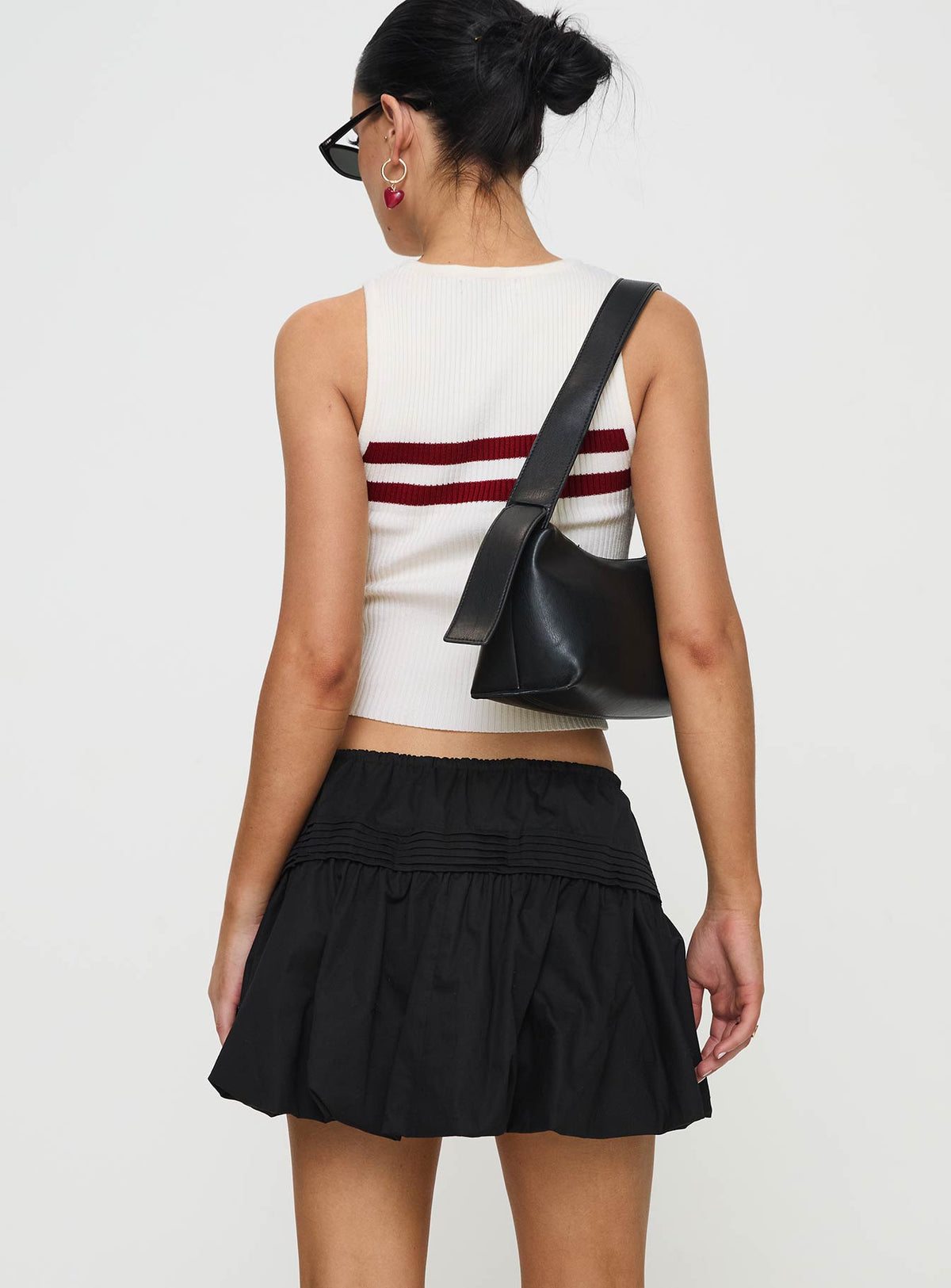 back view of model wearing Princess Polly Dear London Bubble Hem Mini Skirt Black Mini Skirts Skirts 