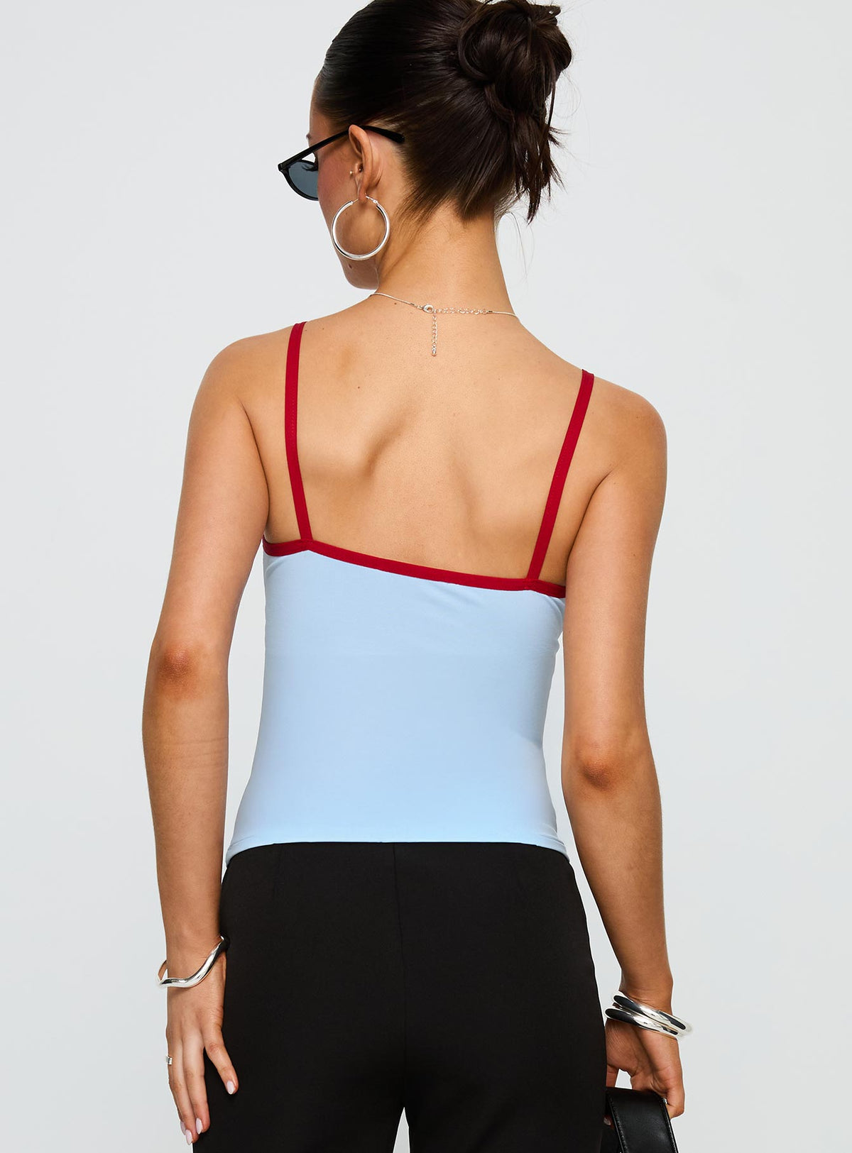 back view of model wearing Princess Polly Tiera Top Blue / Red Sleeveless V-Neck 