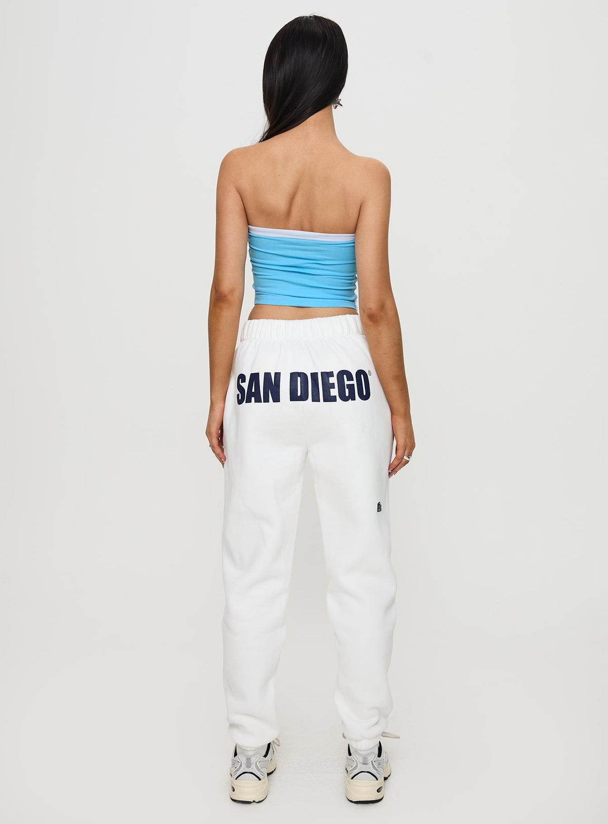Presenting USD Sweatpants White in womens-regular-pants with mid-rise waist, back view of model wearing Princess Polly