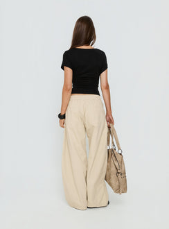 back view of model wearing Princess Polly Selective Memory Low Rise Wide Leg Cargo Pants Cream Low Rise Pants Pants 
