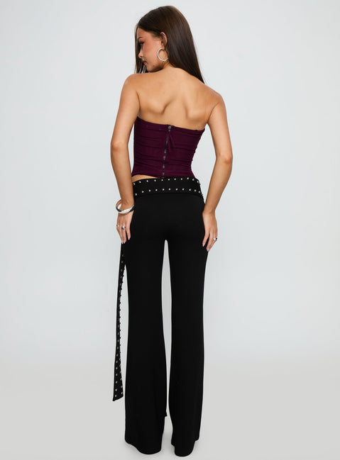 back view of model wearing Princess Polly Nikolia Studded Wrap Belt Pants Black Mid Rise Pants Pants 