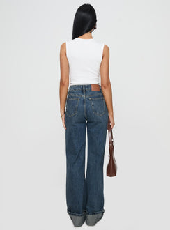 back view of model wearing Princess Polly Florida Keys Cuffed Jeans Mid Blue High Waisted 
