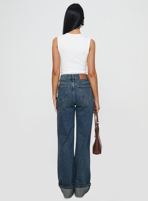 back view of model wearing Princess Polly Florida Keys Cuffed Jeans Mid Blue High Waisted 