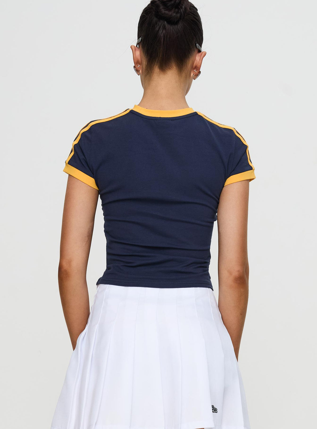 back view of model wearing Princess Polly UCSD Goalie Baby Tee Navy Short Sleeves Crew Neck 