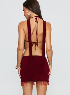 back view of model wearing Princess Polly Ginah Bead Tassel Mini Skirt Red Mini Skirts Skirts 