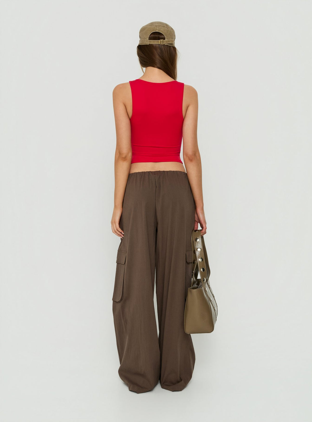 Showcasing the Lunea Concealed Waistband Cargo Pants Brown Petite in womens-regular-pants with mid-rise back view of model wearing Princess Polly