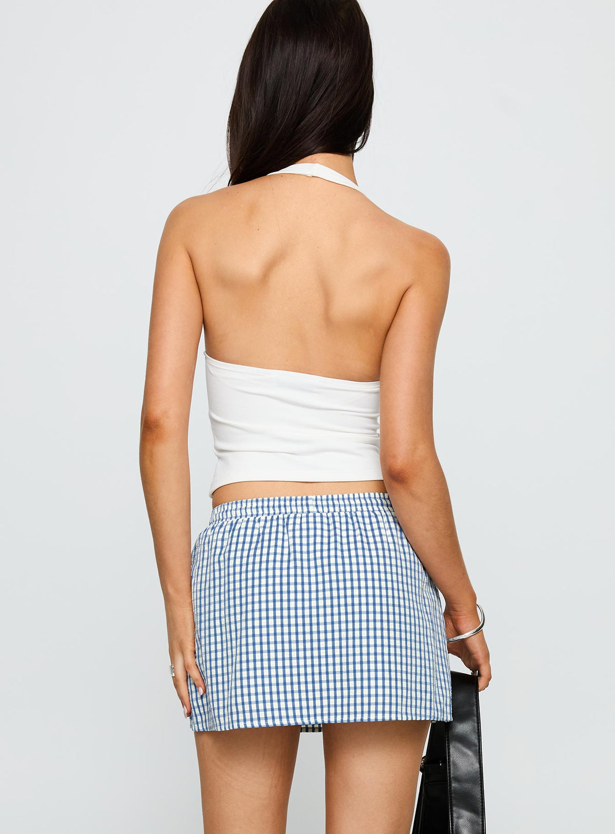 back view of model wearing Princess Polly Impress Me Halter Top White Full Sleeves Plunger 