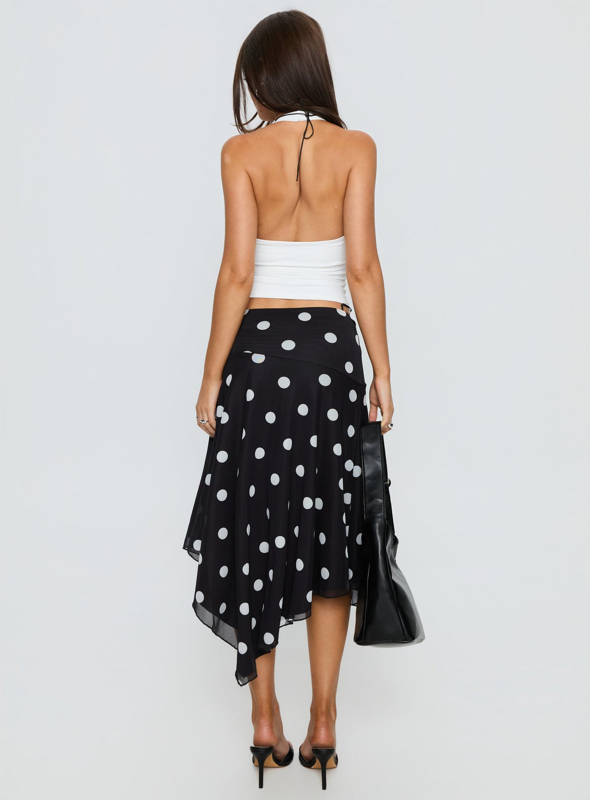 back view of model wearing Princess Polly Dulciana High Split Asymmetrical Midi Skirt Black / Polka Dot Midi Skirts Skirts 
