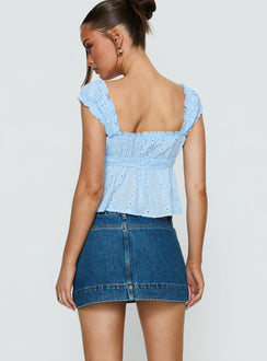back view of model wearing Princess Polly Warna Low Rise Denim Mini Skirt Mid Blue Wash Mini Skirts Skirts 