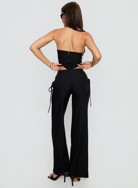 back view of model wearing Princess Polly Riane Lace Up Pants Black Mid Rise Pants Pants 