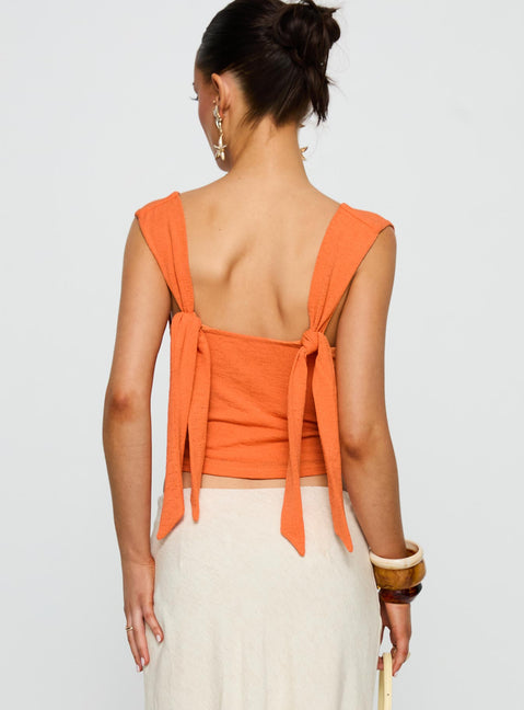 back view of model wearing Princess Polly Steward Top Orange Sleeveless Plunger 