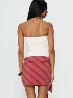 back view of model wearing Princess Polly Lindsy Tie Side Mini Skirt Red Multi Mini Skirts Skirts 