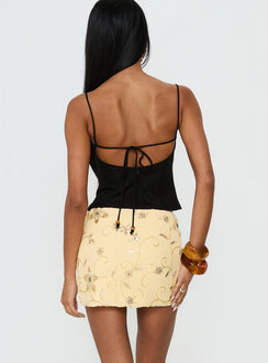 back view of model wearing Princess Polly Calyra Embroidered Mini Skirt Butter Yellow Mini Skirts Skirts 
