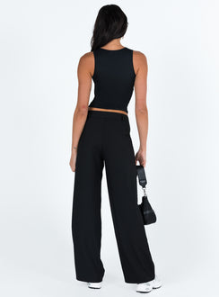back view of model wearing Princess Polly Archie Low Rise Pants Black Petite Mid Rise Pants Pants 