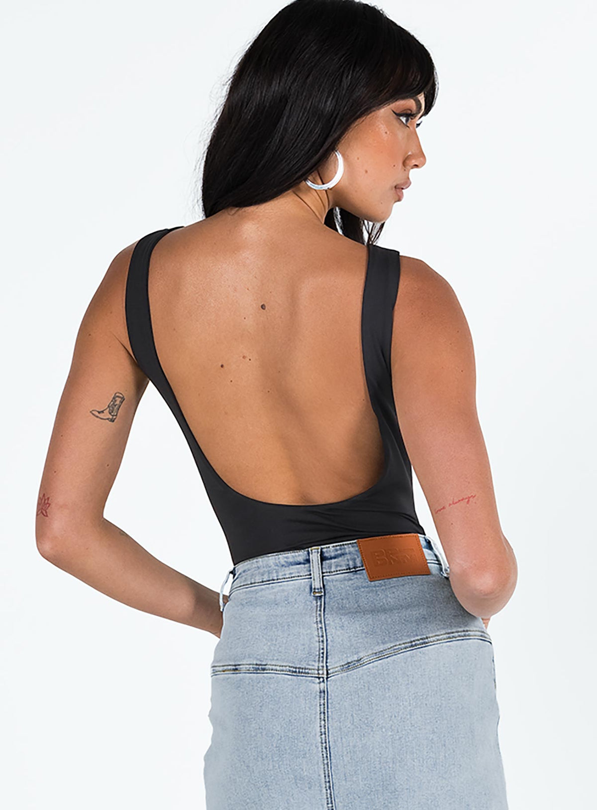 back view of model wearing Princess Polly Beresford Bodysuit Black Sleeveless Bodysuit 
