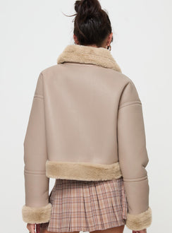 Beige Faux leather jacket Gold toned hardware, zip fastening down front, buckle fastening at neck, twin hip pockets