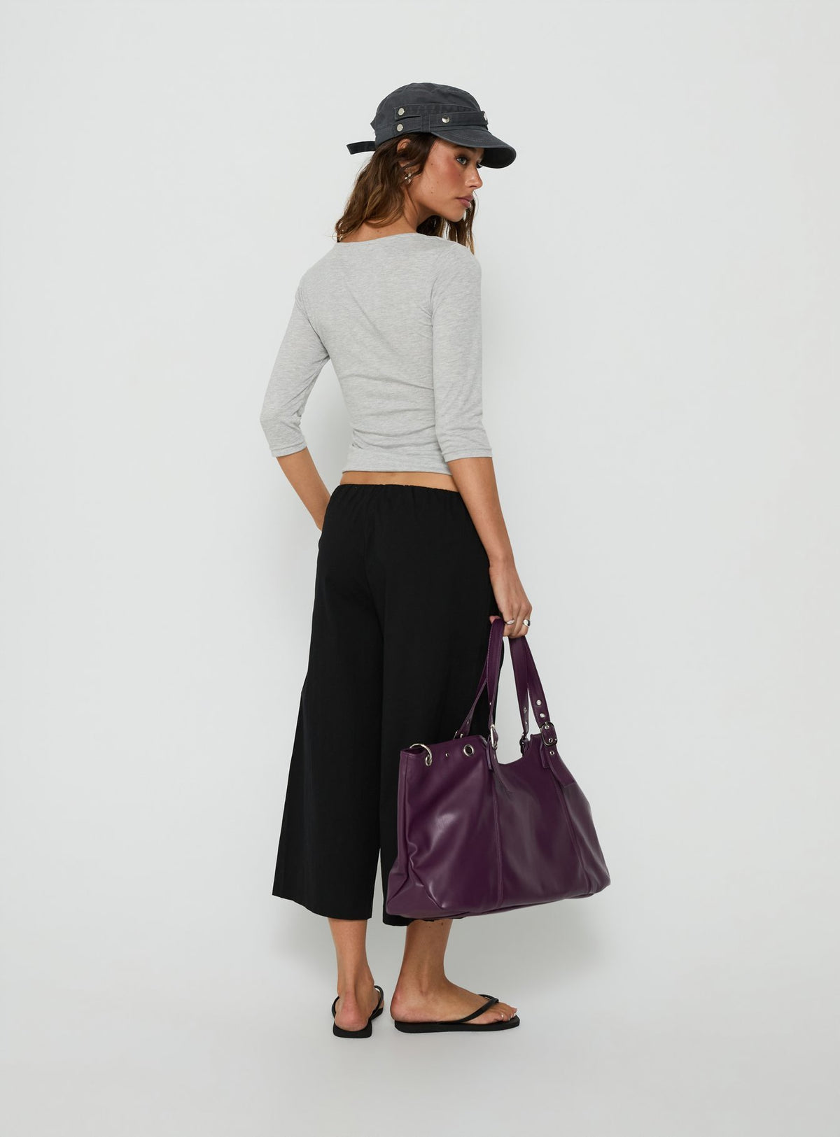 Designed with the Lunea Concealed Waistband 3/4 Pant Black Tall womens-regular-pants in mid-rise back view of model wearing Princess Polly