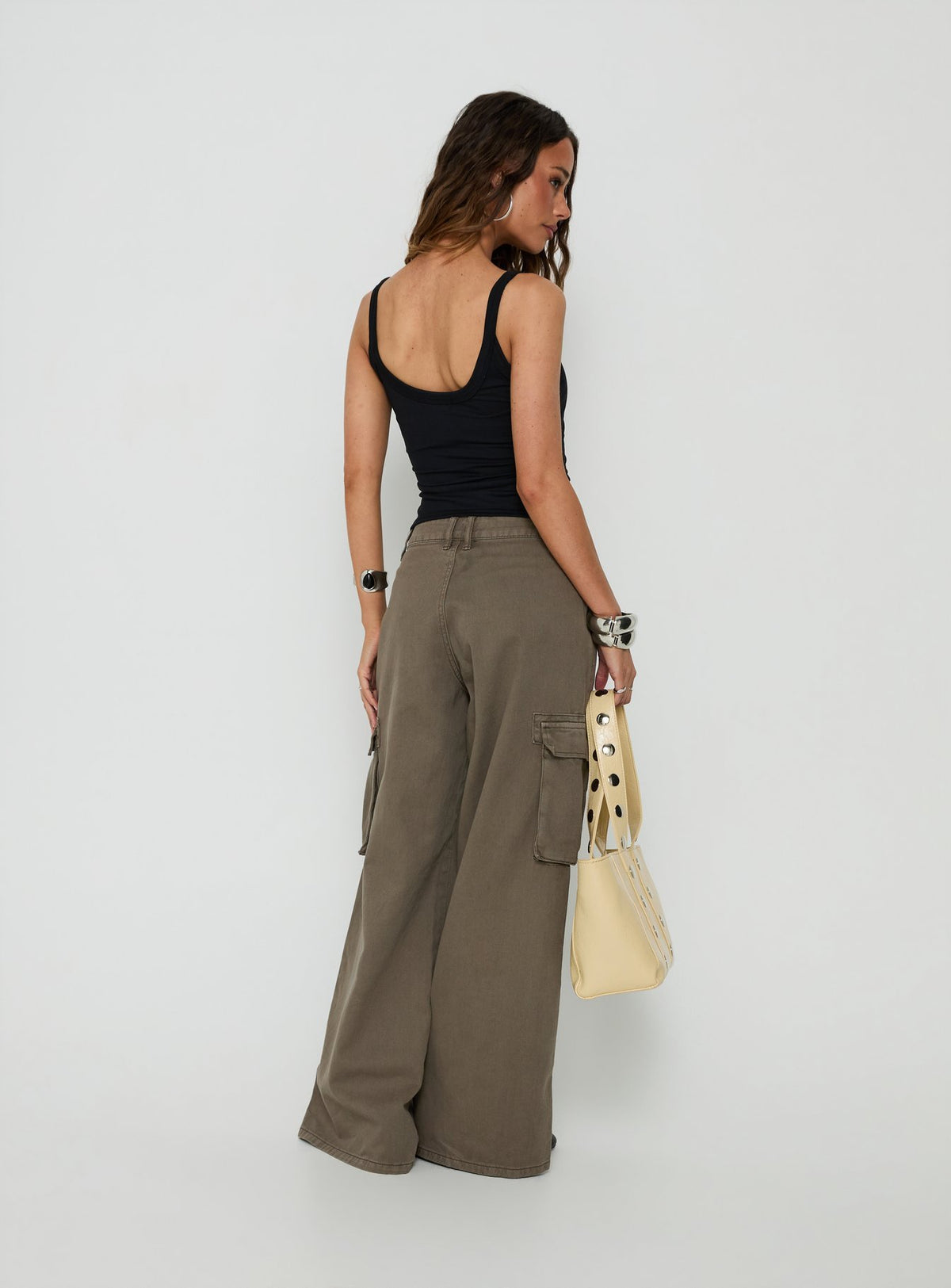 Presenting the Hudsen Cargo Pants in womens regular pants with mid-rise waist back view of model wearing