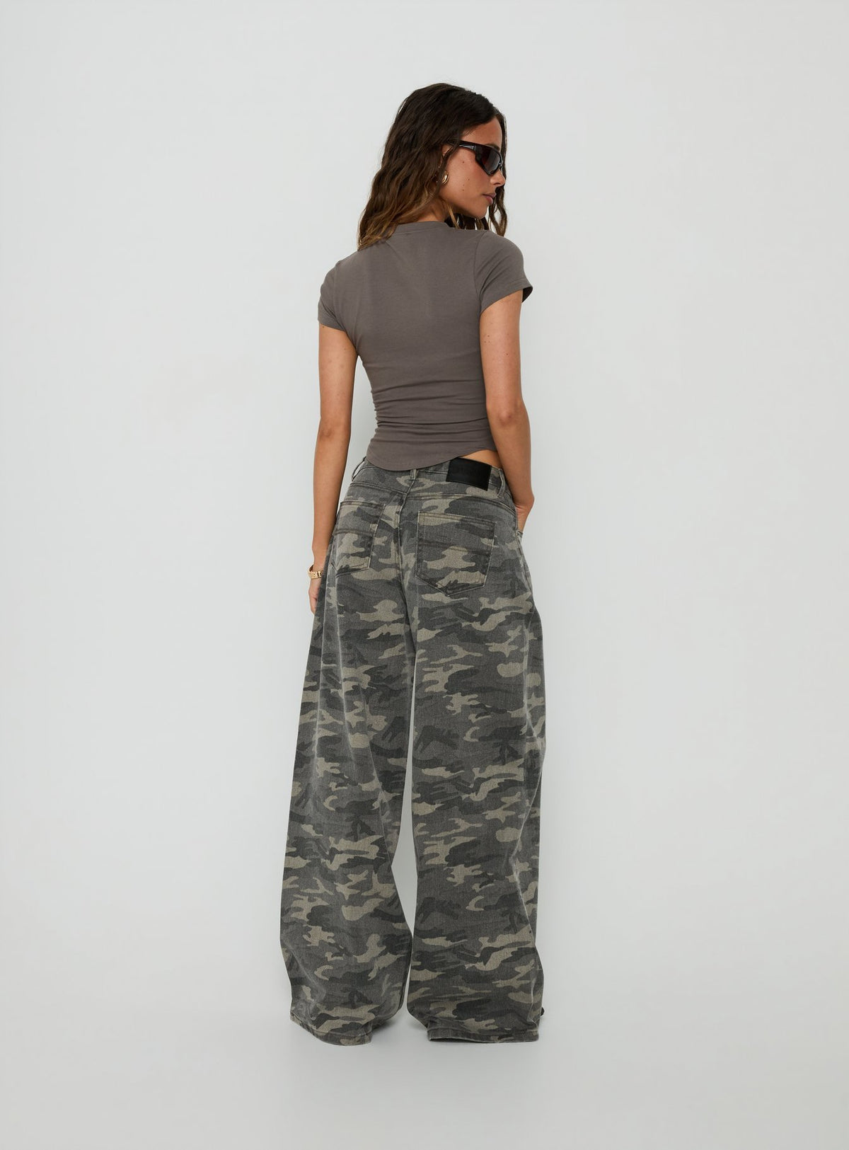 Introducing the Naylor Mid Rise Wide Leg Jeans Camo in womens-jeans featuring belt back view of model wearing Princess Polly