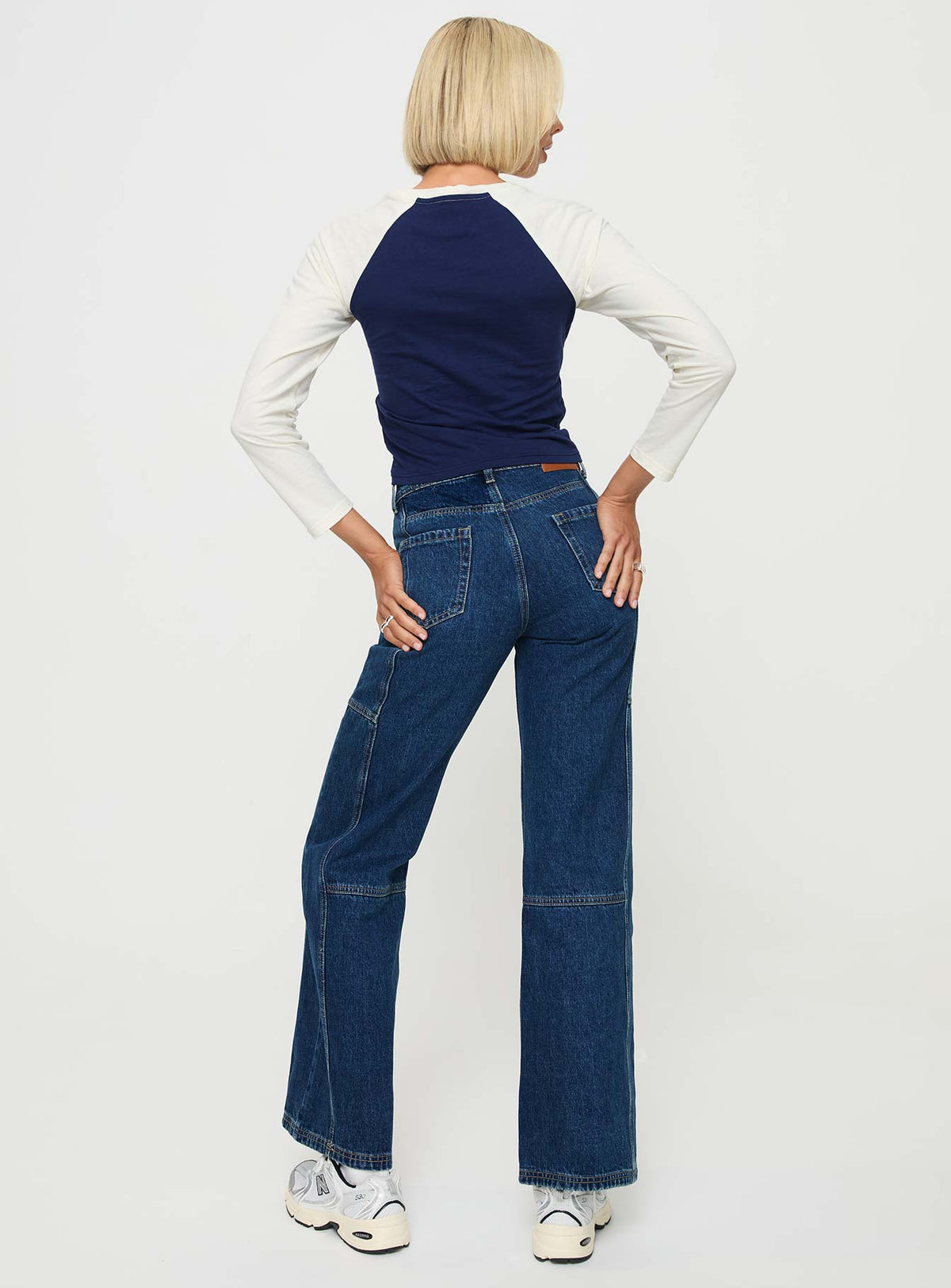 back view of model wearing Princess Polly Chad High Rise Wide Leg Cargo Jeans Dark Wash Denim Mid Rise Jeans Jeans 