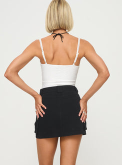 back view of model wearing Princess Polly Lydie Cargo Mini Skirt Black Mini Skirts Skirts 