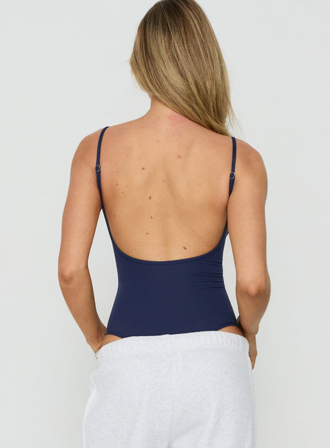 Designed with sleeveless construction, the Daily Define Thin Strap Low Back Bodysuit Navy womens-bodysuit back view of model wearing Princess Polly