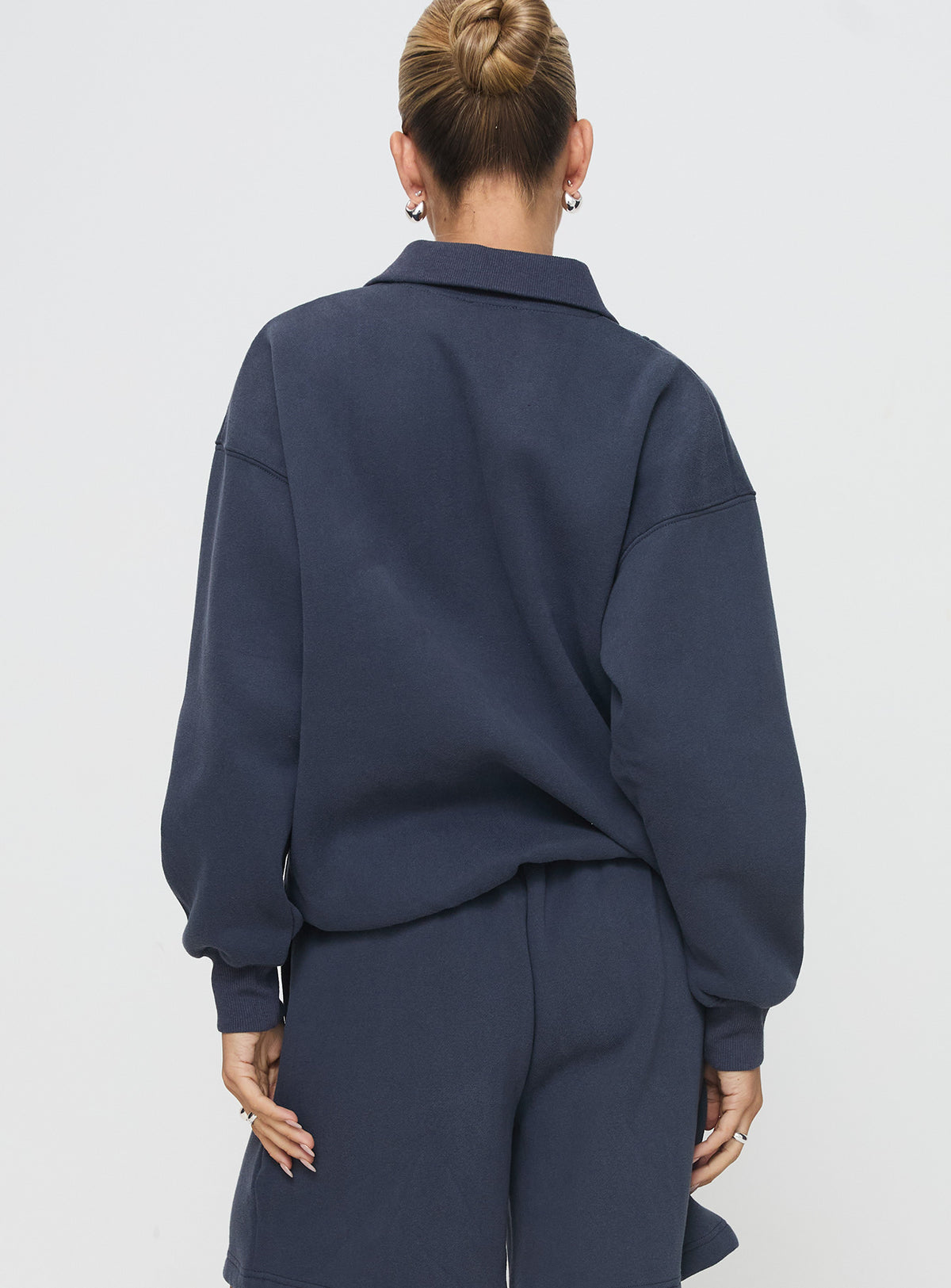 back view of model wearing Princess Polly Dream Fleece Quarter Zip Sweatshirt Navy Jumpers 