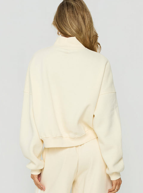 Designed with high neckline the Anyya Funnel Neck Crew Jumper Cream short womens jumper back view of model wearing Princess Polly