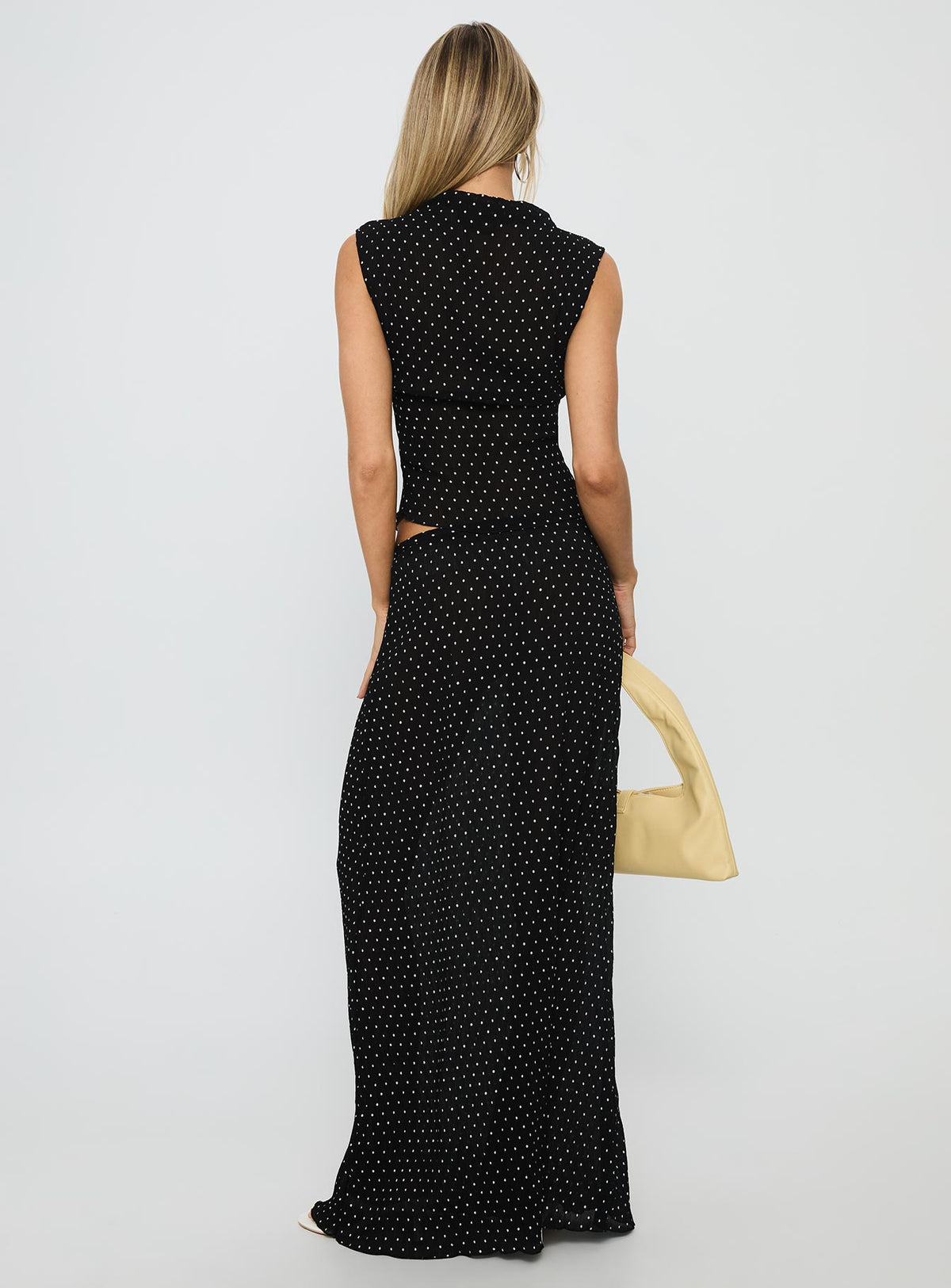 back view of model wearing Princess Polly Ford Maxi Skirt Onyx Polka Maxi 
