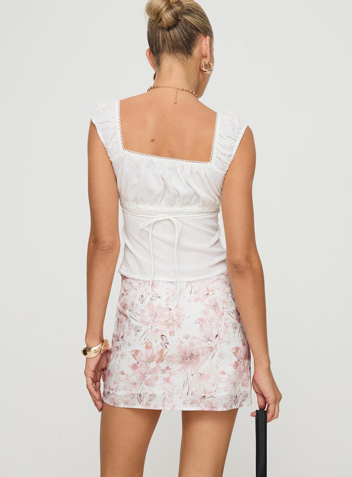 back view of model wearing Princess Polly Gemelli Mini Skirt Floral Mini Skirts Skirts 