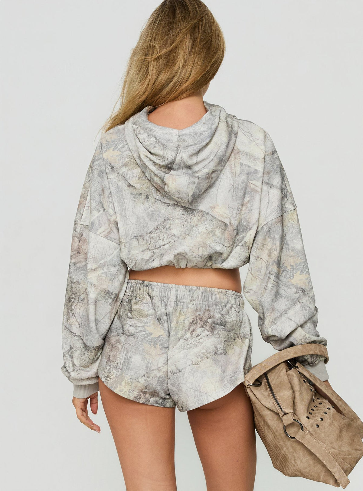 Presenting the Mayse Bubble Hem Cropped Hoodie Camo womens-jumpers in short length with camo print featuring hood and oversized fit back view of model wearing Princess Polly