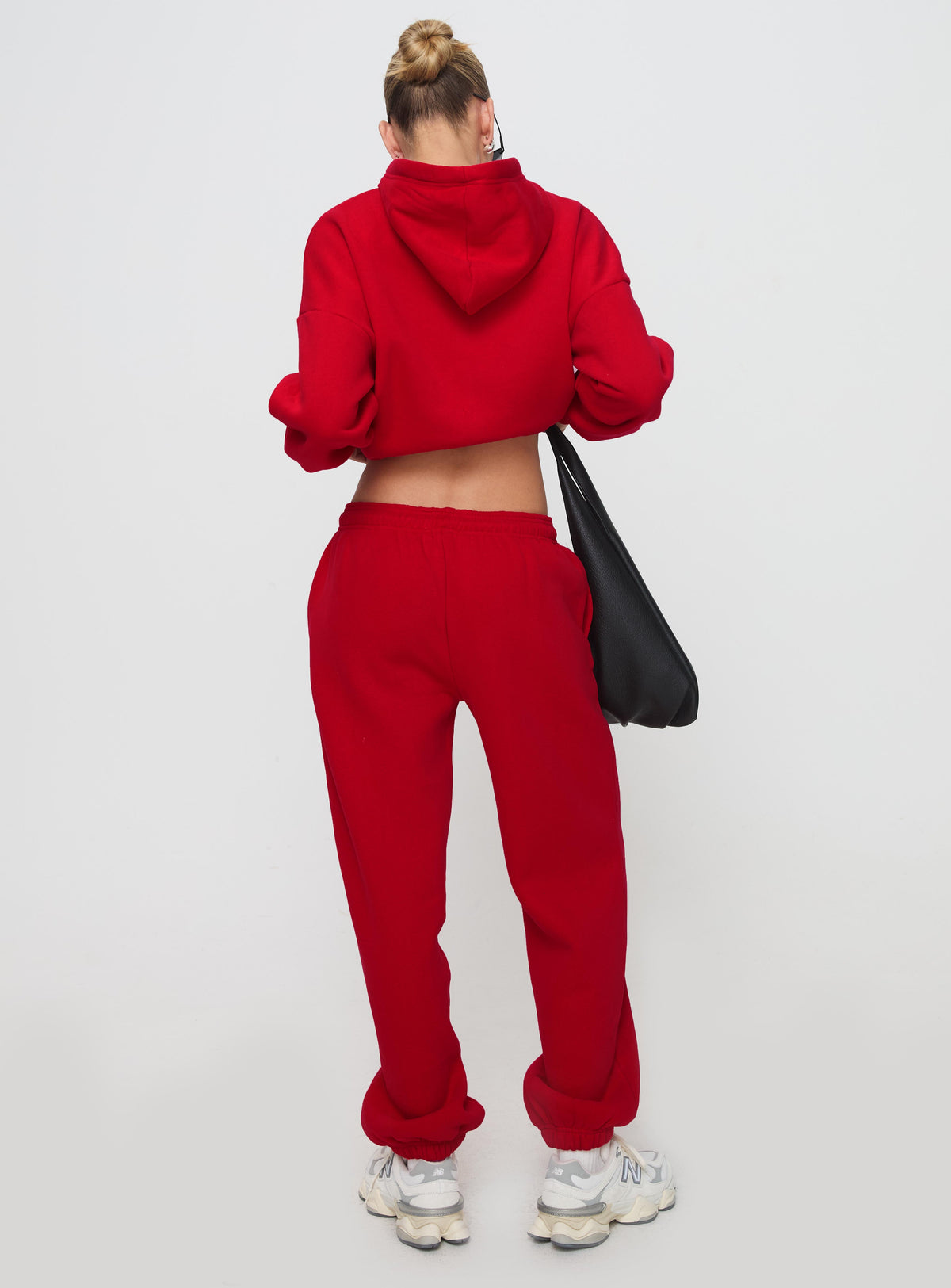 back view of model wearing Princess Polly Dream Fleece Ankle Cuff Sweatpants Red High Rise Pants Pants 