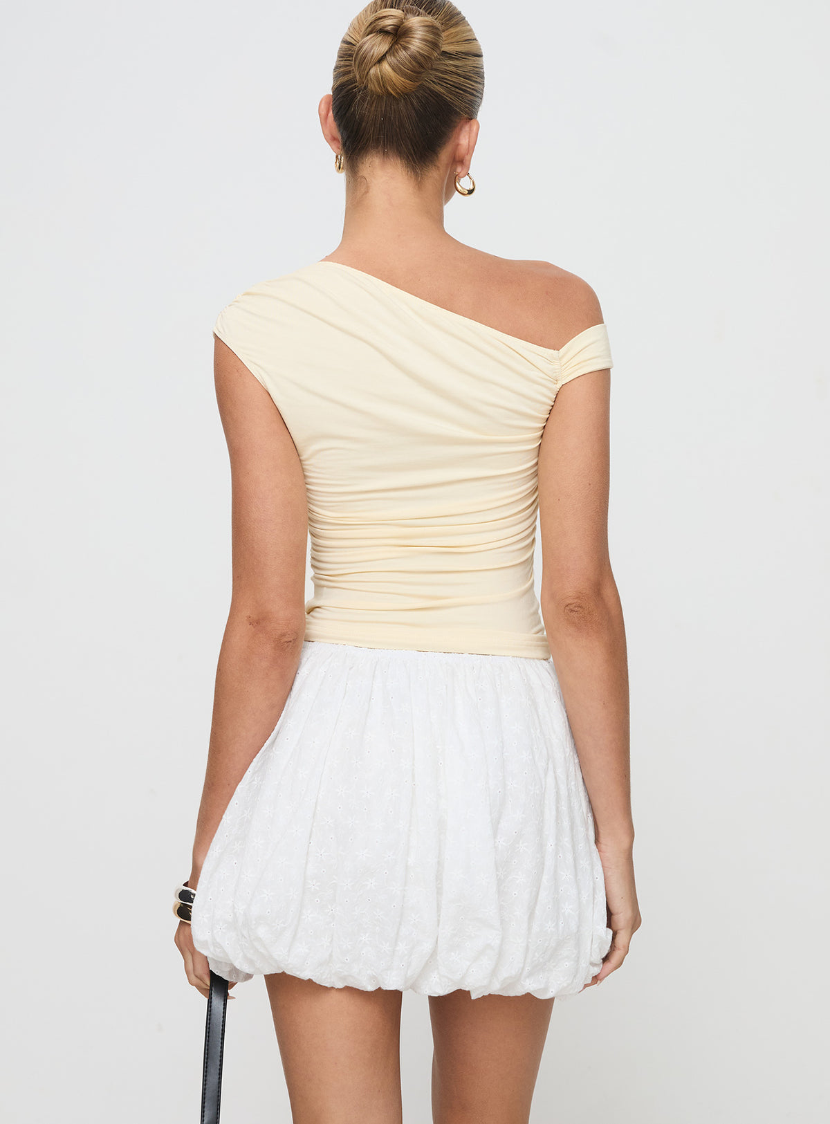 back view of model wearing Princess Polly Anglaise Bubble Hem Mini Skirt White Mini Skirts Skirts 