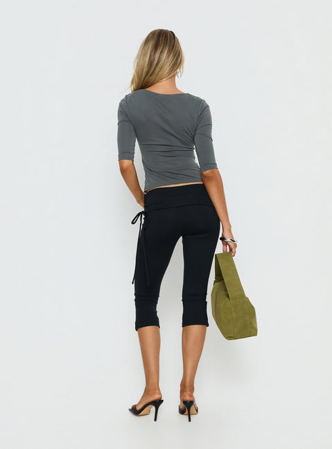 Presenting the Bailor Channel Waistband Capri Pants Black in womens-regular-pants with high-rise and ruched slim design back view of model wearing Princess Polly