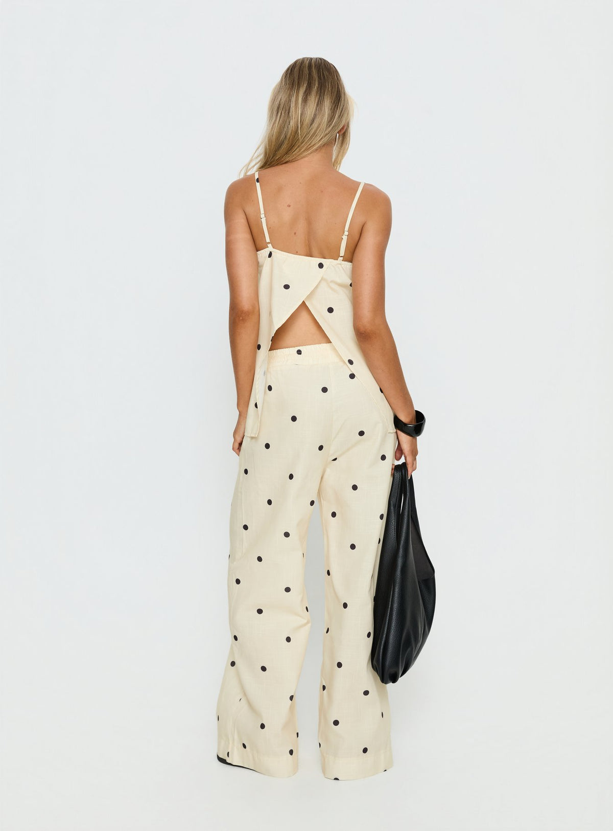 Stylish Bellara Tie Waist Pants Yellow Polka womens regular pants with mid-rise, wide-leg design and polkadot pattern back view of model wearing Princess Polly