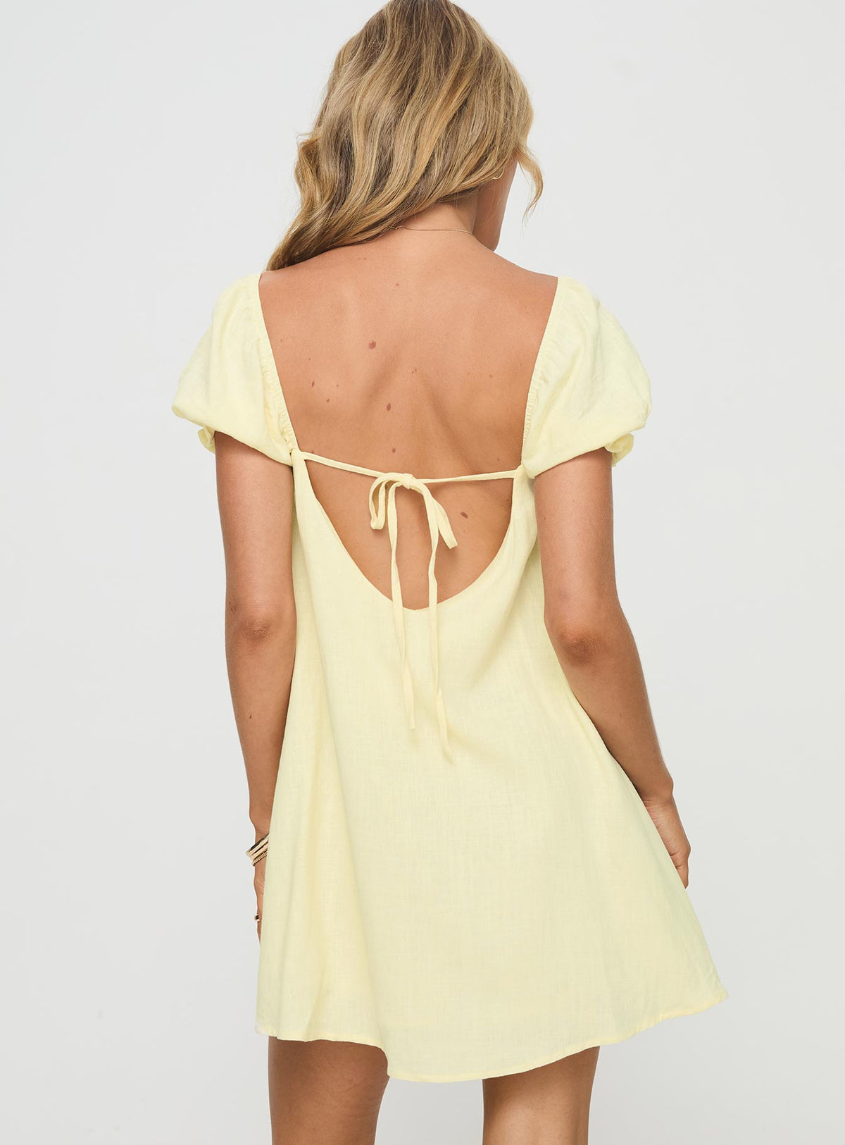 back view of model wearing Princess Polly Beyond Linen Blend Mini Dress Yellow Square Neck 