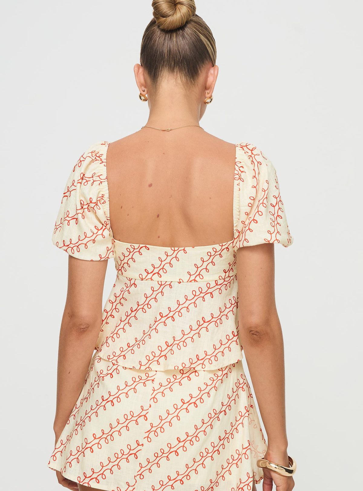 back view of model wearing Princess Polly Passionfruit Linen Blend Top Multi Short Sleeves Square Neck 